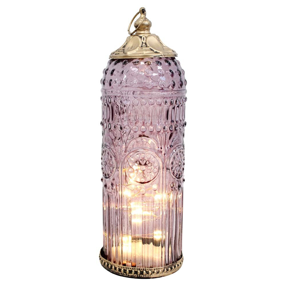 Decorative lantern with intricate design and warm glow on a white background