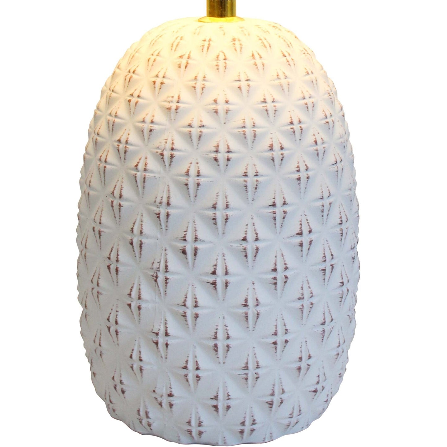 Table lamp with textured white base and beige shade on a white background