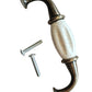 Decorative metal hook with white ceramic center and screws on a white background