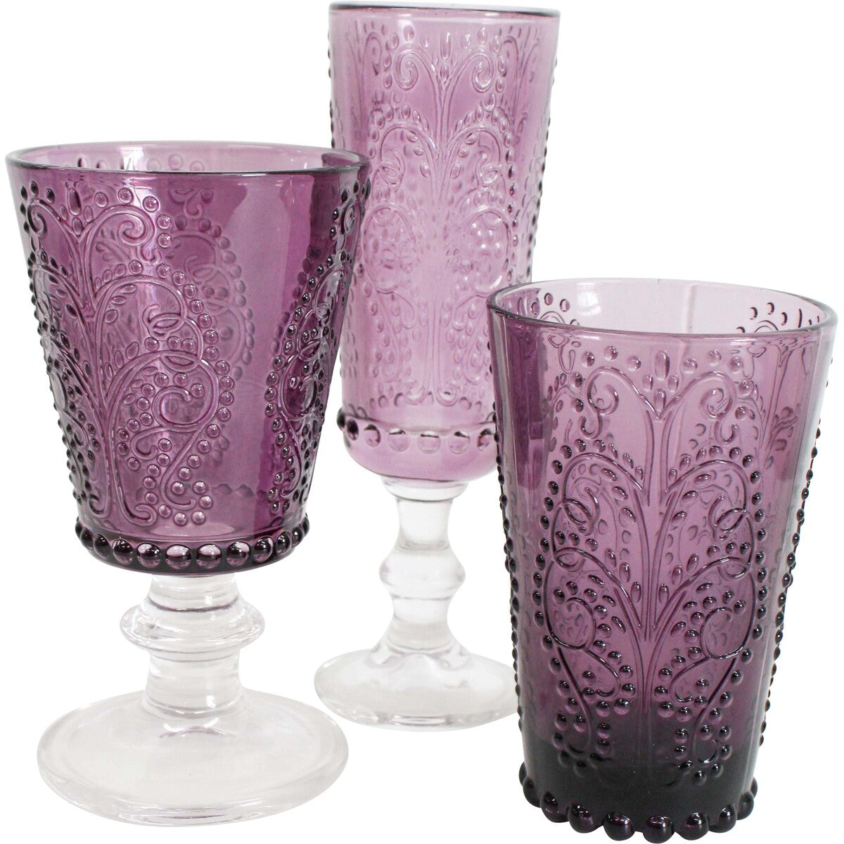 Set of three purple glass goblets with intricate designs on a white background
