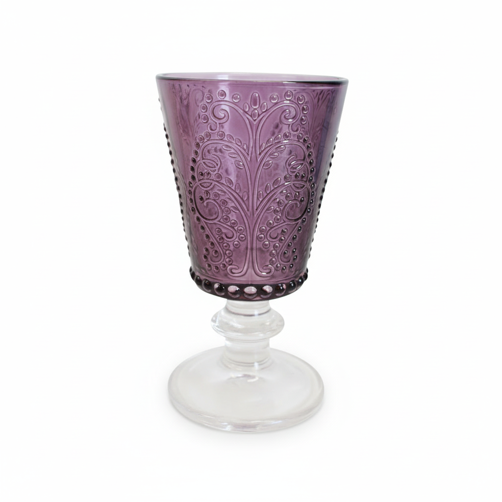 Purple embossed glass with a clear stem on a white background