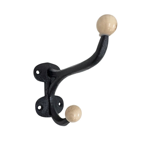 Black metal wall hook with beige wooden knobs on a white background