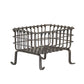Wrought iron fire basket on a white background