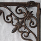 Decorative wrought iron bracket on a white fabric background