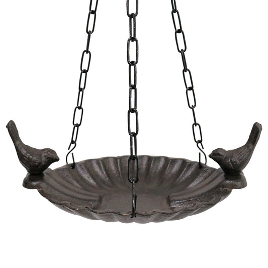Black metal bird bath with chain and birds on a white background
