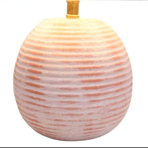 Round ceramic lamp with ribbed texture on a white background