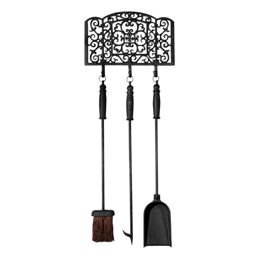 Decorative fireplace tool set with broom, brush, and shovel on a white background