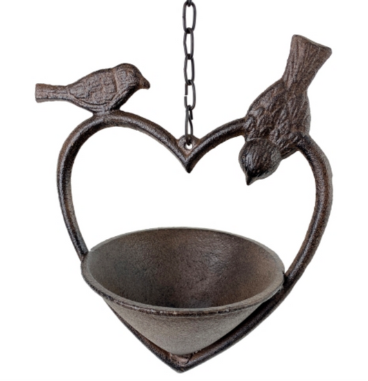 Decorative metal birdfeeder shaped like a heart with two birds on a white background