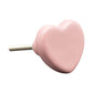 Pink heart-shaped object on a white background
