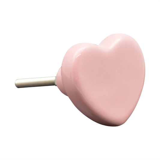 Pink heart-shaped object on a white background