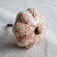 Ceramic knob with decorative pattern on a white background