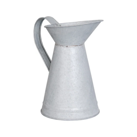 Metal pitcher on a white background